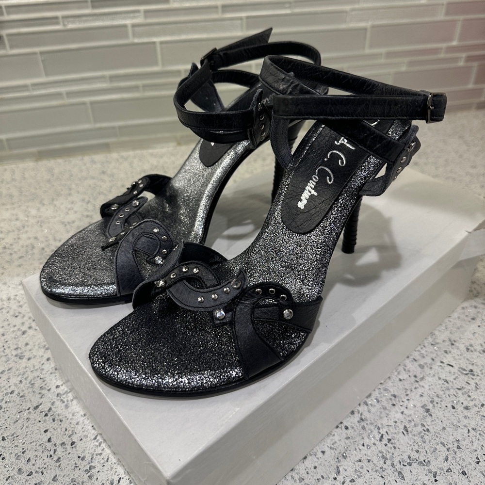 David C. Couture grey/silver heels with straps Sz 7
Never worn!